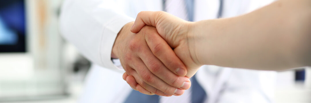 Doctor and patient handshake