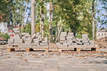 paving slabs on pallets. reconstruction of sidewalks. construction works.