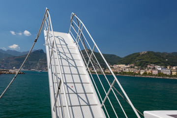 Fototapeta na wymiar Sea gangway on the background of the coast of the city of Salermo in Italy