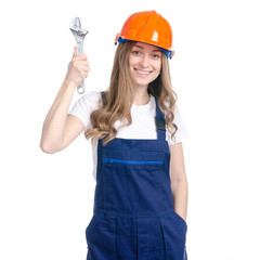 Woman builder with work helmet holding construction key on white background isolation
