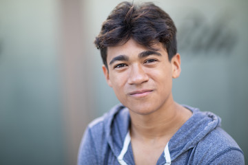 Portrait of a handsome Asian young man next to the blurred background