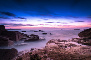 Fototapeta na wymiar Sunset and smooth water on the pink granit coast in Brittany