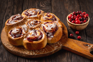 Homemade cranberry and orange swirl buns with glaze.