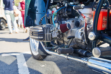 close-up boxer engine of a retro motorcycle at an auto show.