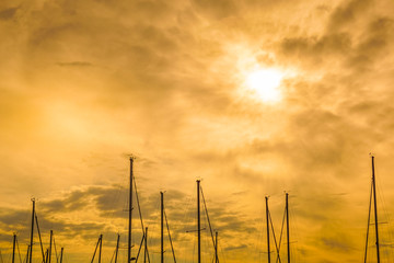 Obraz premium Boat masts and sunset.