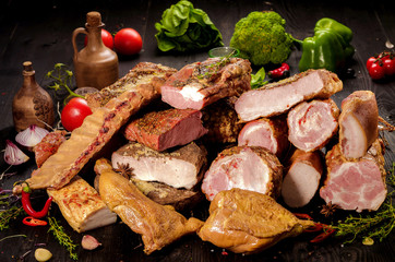 smoked meat on the table with vegetables
