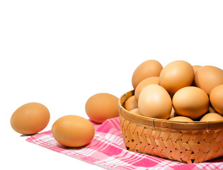 the eggs in a basket on a white background