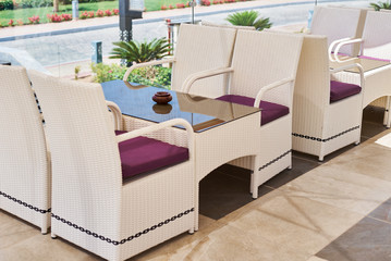 Empty terrace with a table and chairs outdoor in summer day