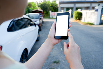 Cropped shot view of business woman’s hands holding the mobile phone with blank copy space screen for your information content or text message, the woman reading text message on the smart phone during