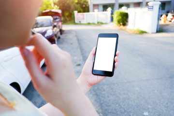 Cropped shot view of business woman’s hands holding the mobile phone with blank copy space screen for your information content or text message, the woman reading text message on the smart phone during