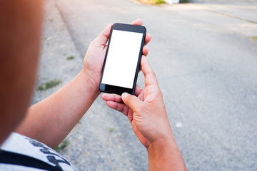 Cropped shot view of business woman’s hands holding the mobile phone with blank copy space screen for your information content or text message, the woman reading text message on the smart phone during
