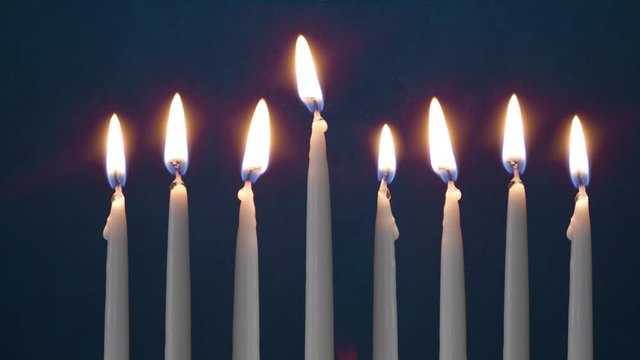 Video Of Seven Lit Hanukkah Candles ON GRUNGE BACKGROUND And Shamash