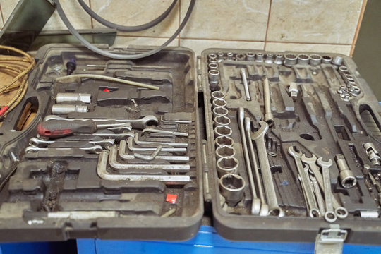 a set of tools for repairing cars on a table in a car service