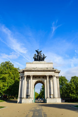 Fototapeta na wymiar Wellington Arch Monument on a sunny day with white clouds