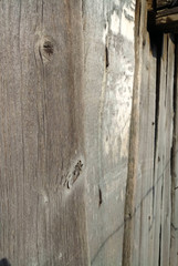 texture of old shabby rustic wooden fence made of planks, with rusty nails, grunge background