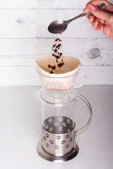 ground coffee is placed in a funnel v60, for alternative brewing