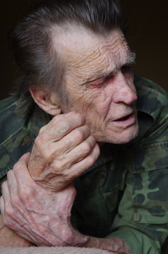 portrait of a blind and deaf elderly man veteran