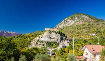 A view of the ancient village of Cerro al Volturno, surrounded by green woods and mountains. The...
