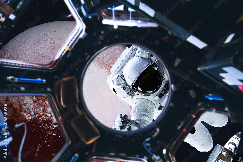 Wall mural astronaut near planet pluto of solar system in space with far galaxy on the background. view from sp
