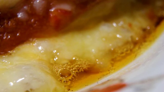 Closeup of the boiling cheese - preparation process