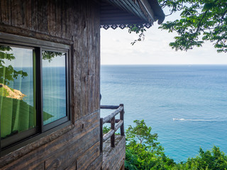 view of the sea on which there is a motor boat from the terrace of the house. Koh Phangan. Thailand.