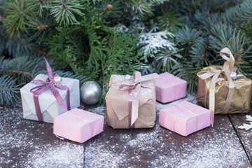 New year background present boxes and branches of fir tree