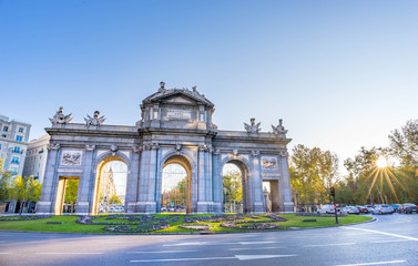 Obraz premium The Alcala Door (Puerta de Alcala) is a one of the ancient doors of the city of Madrid, Spain. It was the entrance of people coming from France, Aragon, and Catalunia. It is a landmark of the city.