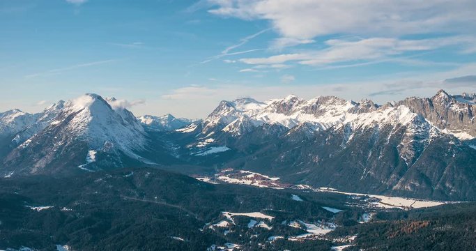 Timelapse with moving clouds above the snow-capped Wetterstein and Mieminger mountains 