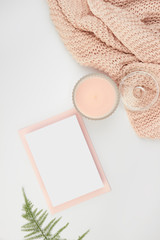 white space flatlay rose pastel pink peach candle paper sheet card invitation envelope foliage floral wool blanked plaid cozy female