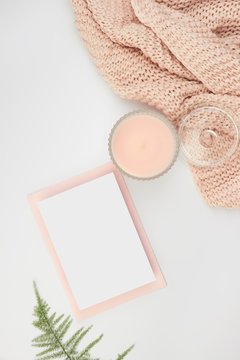 white space flatlay rose pastel pink peach candle paper sheet card invitation envelope foliage floral wool blanked plaid cozy female