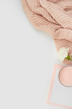 white space flatlay rose pastel pink peach candle paper sheet card invitation envelope white flower wool blanked plaid cozy female