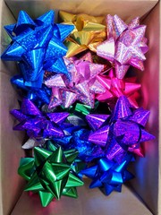 Gift Wrapping Bows. Collection of colorful holiday gift wrapping bows. Materials for wrapping gifts. Christmas presents preparation.