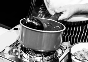 Chef cooking in a kitchen, chef at work, Black & White.