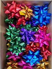 Gift Wrapping Bows. Collection of colorful holiday gift wrapping bows. Materials for wrapping gifts. Christmas presents preparation.