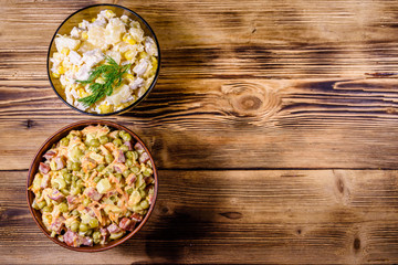 Set of festive mayonnaise salads on wooden table. Top view