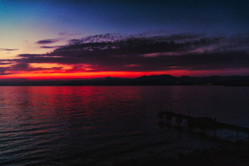 Fototapeta na wymiar Deep blue red sunset over the sea