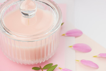 pink pastel candle in glas peach cream paper card flower petals 