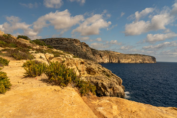 view of malta coast and mediterranean sea at blue grotto, malta
