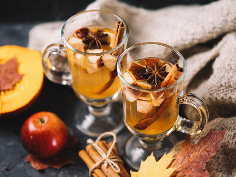 Hot Autumn And Winter Alcoholic Drink Sangria Or Cider On The Table With Apple, Pumpkin, Cinnamon, Anise