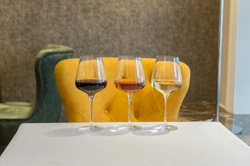 Red, rose and white wine in glasses