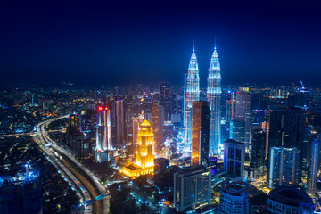 Fototapeta na wymiar Petronas twin towers and highway in Kuala Lumpur
