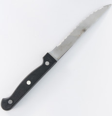 A saw knife with plastic handle for cutting meat