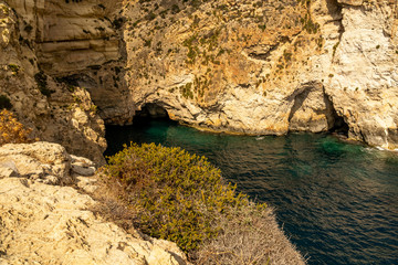 view of malta coast and mediterranean sea at blue grotto, malta