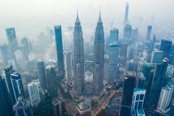 Petronas Twin Towers in foggy morning