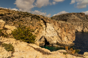 Fototapeta premium view of malta coast and mediterranean sea at blue grotto, malta