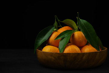 sweet and ripe whole and peeled mandarins (tangerines) on white background isolated