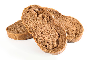 Slices of freshly baked bread on a white isolated background. Close-up.