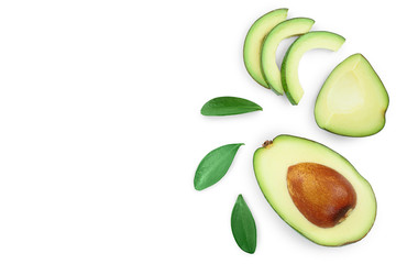 avocado and slices decorated with green leaves isolated on white background with copy space for your text. Top view. Flat lay