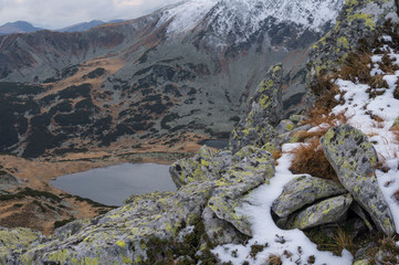 Snow covered mountain peak. Retezat Mountains Panorama. Retezat National Park mountains in South Carpatians, Transylvania, Romania, Europe