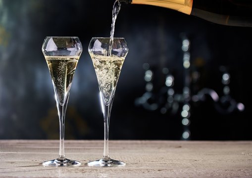 Pouring champagne into glasses